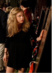 Girl Looking at Spirit of Freedom Plaque